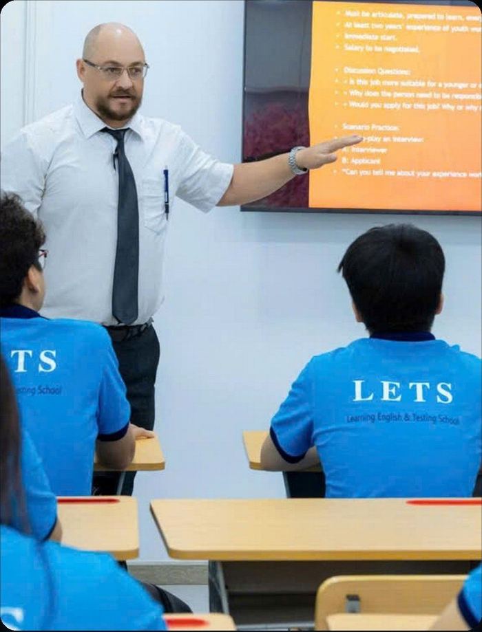 Lionel leading a Business English class